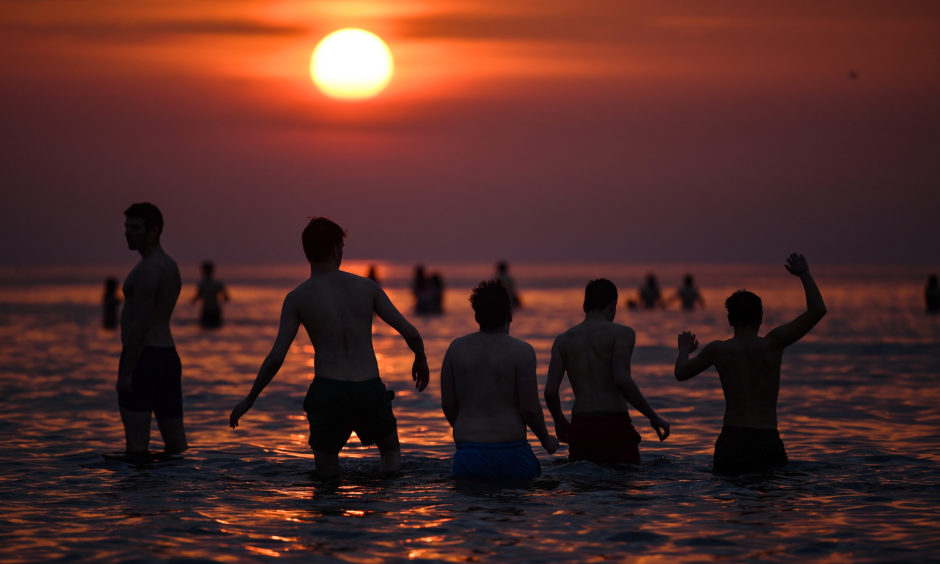 IN PICTURES: St Andrews University annual May Day dip - The Courier