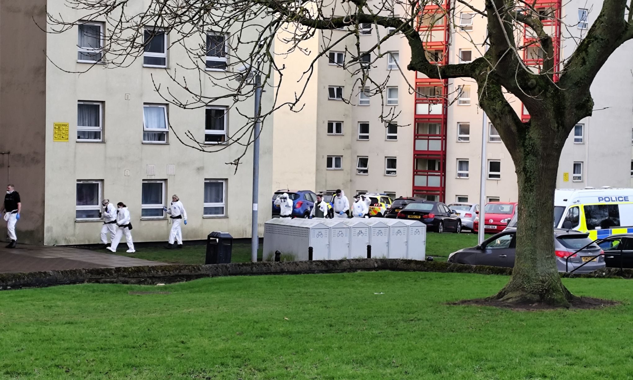 Forensics officers at Dunfermline flats as police carry out raid