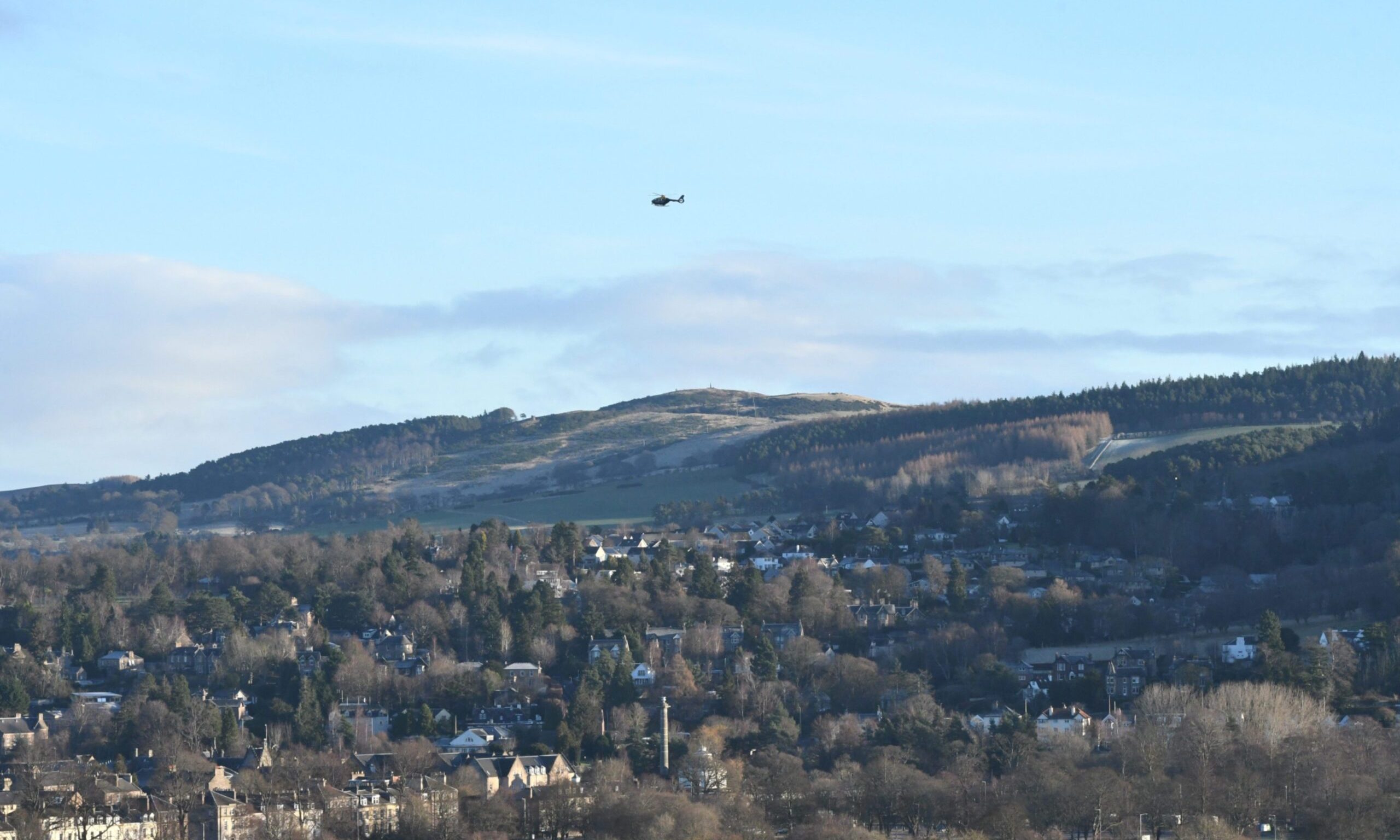 Police helicopter searching for missing person John McNeil in Perth